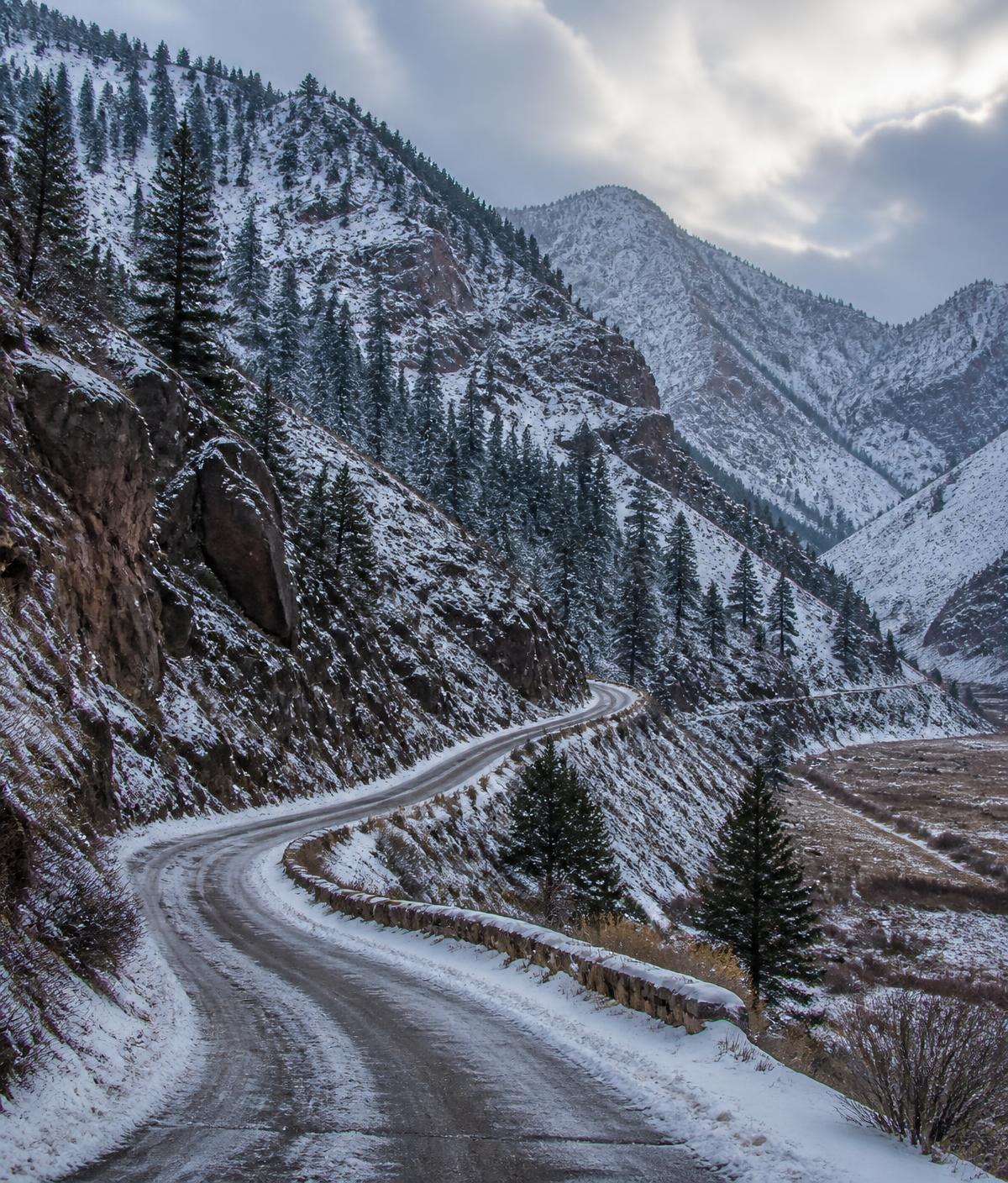 Road winding toward a canyon above the Salt Lake Valley