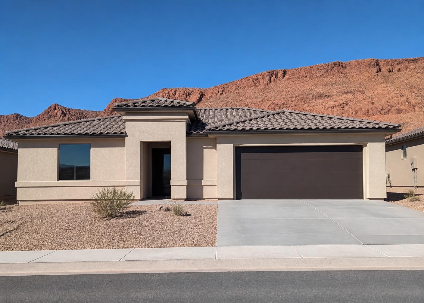 New tile-roofed stucco home under construction in Washington Fields near St. George