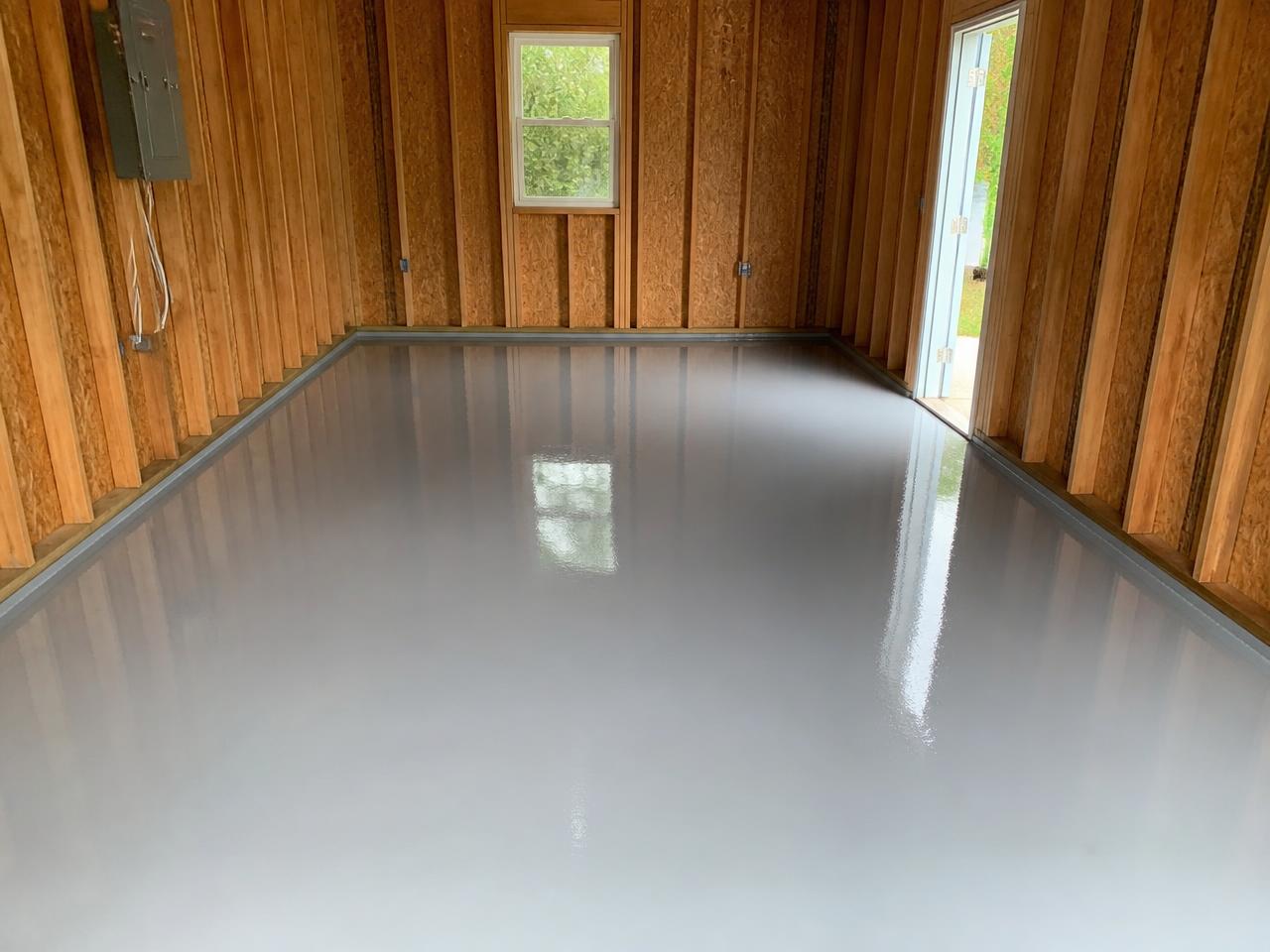 Newly epoxied garage floor in a Pittsburgh single-bay garage