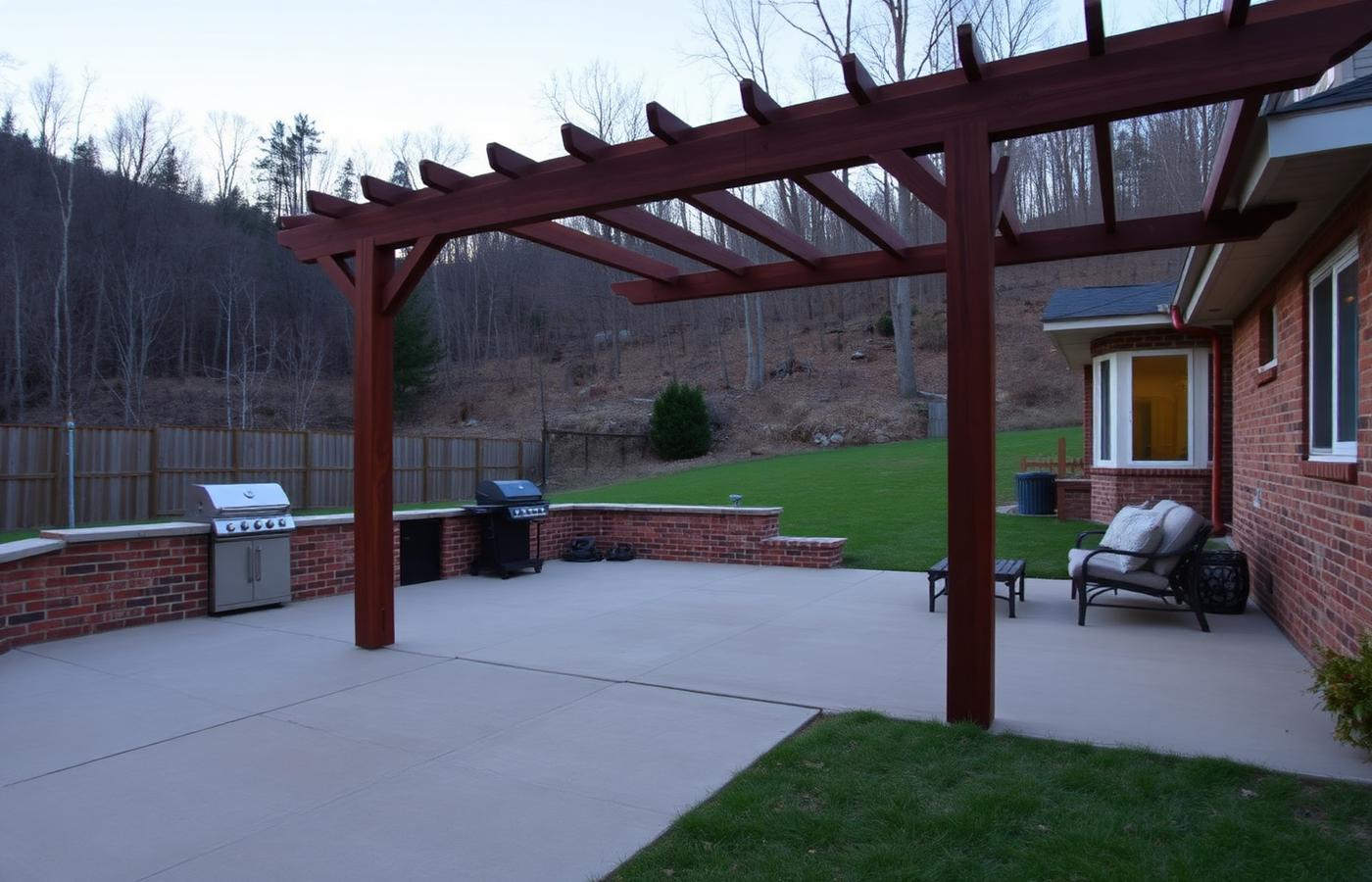 Stone paver patio with outdoor seating and warm string lights behind a home at dusk