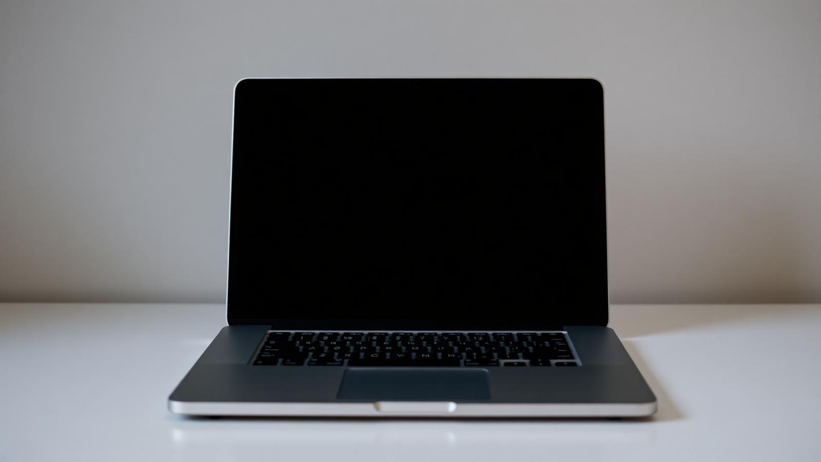 Open laptop with a blank screen on a desk, representing a Houston contractor website build